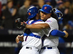 New York Mets relief pitcher Jeurys Familia celebrates with catcher Travis d'Arnaud after defeating the Kansas City Royals in game three of the World Series at Citi Field. (Robert Deutsch/USA TODAY Sports)