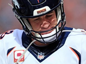 Quarterback Peyton Manning of the Denver Broncos shows his displeasure against the Cleveland Browns October 18, 2015 in Cleveland.   (Andrew Weber/Getty Images/AFP)