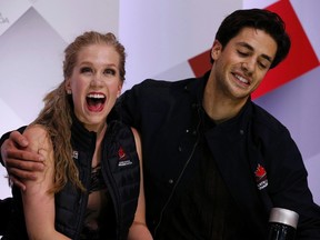 Kaitlyn Weaver and Andrew Poje of Canada celebrate following their Ice Dance free program at Skate Canada International in Lethbridge October 31, 2015. (REUTERS/Jim Young)