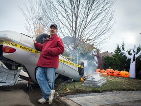 Andrew Theodore standing next to his latest Halloween display at his home in Barrhaven. For 10 years, Theodore has been producing extravagant Halloween displays. However, this year, Theodore was told to take it down by Ottawa police.
DANI-ELLE DUBE/Ottawa Sun
