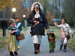 Prime Minister-designate Justin Trudeau, dressed as Han Solo, walks with his children Hadrien, 2ndR, Ella-Grace and Xavier, as his wife Sophie Gregoire jokes with onlookers as the family prepares to go trick-or-treating on Halloween in Ottawa on October 31, 2015. REUTERS/Justin Tang/Pool