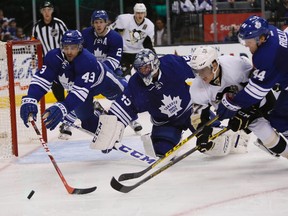 Toronto Maple Leafs forward Nazem Kadri, goaltender Jonathan Bernier, and defenceman Morgan Rielly go after a loose puck against Pittsburgh Penguins forward David Perron(John E. Sokolowski-USA TODAY Sports)