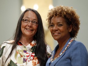 Canadian actress Tantoo Cardinal (left) smiles after being awarded the rank of Member in the Order of Canada by Governor General Michaelle Jean at Rideau Hall in Ottawa September 3, 2010. In the Days of Our Grandmothers: A Reader in Aboriginal Women’s History in Canada, is essential reading for anyone interested in aboriginal history in Canada. From Ellen Gabriel to  Cardinal, many of the faces of aboriginal people in the media today are women.      REUTERS/Chris Wattie       (CANADA - Tags: POLITICS ENTERTAINMENT)