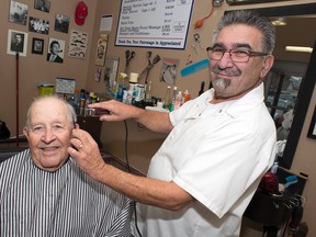 Johnny Leroux gets his hair cut by Frank Oldzynko — on the house. Olzynko, the owner of Heads Up, is offering free hair cuts to veterans leading up to Remembrance Day. DANI-ELLE DUBE/OTTAWA SUN