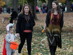 Two-year-old Ruby Castle dressed as an elephant with her mother Shannon Castle and friend Carin Campbell at  McBurney Park for the Halloween parade in Kingston, Ont. on Saturday October 31, 2015. Steph Crosier/Kingston Whig-Standard/Postmedia Network