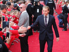 Chicago Blackhawks' Patrick Kane walks the red carpet before an NHL hockey game between the Blackhawks and the New York Rangers Wednesday, Oct. 7, 2015, in Chicago. (AP Photo/Charles Rex Arbogast)
