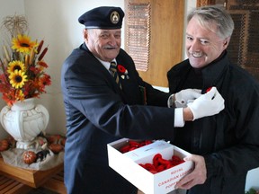 Royal Canadian Legion's Ron Chafe, of Branch 62, pins a poppy on Sarnia Mayor Mike Bradley to kick off its annual Remembrance Days campaign on Sunday November 1, 2015 in Sarnia, Ont. (BARBARA SIMPSON, The Observer)