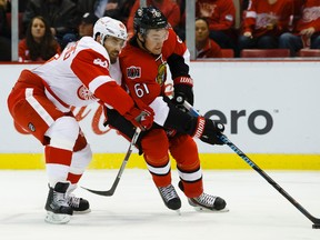 Ottawa Senators right wing Mark Stone (61) skates with the puck as Detroit Red Wings left wing Henrik Zetterberg (40) defends in the second period at Joe Louis Arena Friday, Oct. 30, 2015. Rick Osentoski-USA TODAY Sports