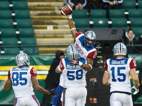 Montreal's Fred Stamps (2) celebrates a touchdown with teammates during the first half of a CFL game between the Edmonton Eskimos and the Montreal Alouettes at Commonwealth Stadium in Edmonton, Alta.. on Sunday November 1, 2015. Ian Kucerak/Edmonton Sun/Postmedia Network