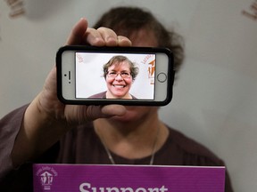Sister Lucinda Patterson poses for a photo as she promotes the 'Support the End of Violence ... One Selfie At A Time' campaign, at the Lurana Shelter Society booth during the Edmonton Women's Show in October. David Bloom/Edmonton Sun/Postmedia Network