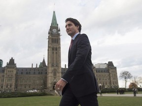 Prime Minister-designate Justin Trudeau walks to a news conference from Parliament Hill in Ottawa, on October 20, 2015. A rare phenomenon is transpiring in a foreign capital where mentioning Canadian politics is generally about as likely to stimulate conversation at a dinner party as to get you disinvited from the next one. People are curious about Trudeau. THE CANADIAN PRESS/Adrian Wyld