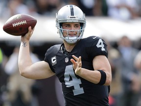 Oakland Raiders quarterback Derek Carr (4) passes against the New York Jets during the first half of an NFL football game in Oakland, Calif., Sunday, Nov. 1, 2015. (AP Photo/Ben Margot)