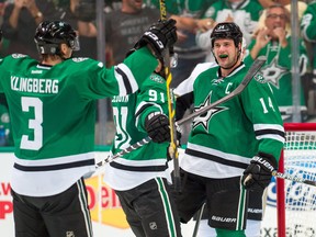 Dallas Stars left wing Jamie Benn (14) celebrates with center Tyler Seguin (91) and defenseman John Klingberg (3) after scoring a goal against the Pittsburgh Penguins during the third period at American Airlines Center. The Stars won 3-0. Jerome Miron-USA TODAY Sports