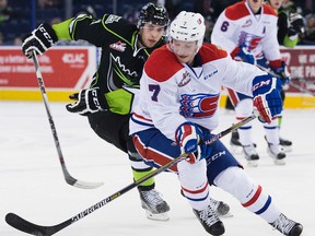 The Edmonton Oil Kings' Tyler Robertson (21) battles the Spokane Chiefs' Evan Fiala (7) during first period WHL action at Rexall Place, in Edmonton, Alta. on Sunday Nov. 1, 2015. David Bloom/Edmonton Sun/Postmedia Network