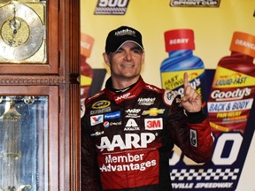 Jeff Gordon, driver of the #24 AARP Member Advantages Chevrolet, poses in Victory Lane after winning the NASCAR Sprint Cup Series Goody's Headache Relief Shot 500 at Martinsville Speedway on November 1, 2015 in Martinsville, Virginia.   Jonathan Moore/Getty Images/AFP