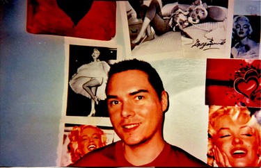 Sex killer Luka Magnotta, serving life in a Quebec prison, poses happily in street clothes against the backdrop of his collection of Marilyn Monroe posters.
