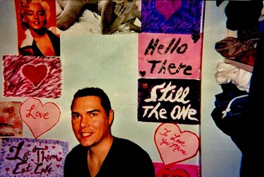 Marilyn Monroe photos, homemade posters and inspirational quotes - "Let Them Eat Cake" - grace the walls of Luka Magnotta's prison home in Quebec. Also note the stack of street clothes on the shelf.