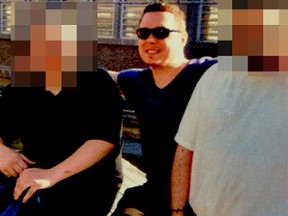 Luka Magnotta, centre, serving a life sentence for killing and dismembering a Chinese student in Montreal, smiles as he poses with a couple of unnamed friends at Archambault Institution in Quebec. According to a friend, and letters from the prison, Magnotta is enjoying a summer camp-like life at his prison, where he wears street clothes and enjoys pizza parties.