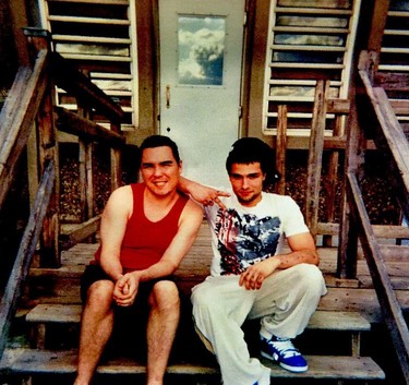 Enjoying summer camp, Luka Magnotta? Canada's most notorious sex killer, left, is all smiles and he hangs out on some wooden steps at Archambault Institution in Quebec with Jonathan Lafrance-Rivard. Lafrance-Rivard is serving 40 months for having sex with girls as young as 12 years old.
