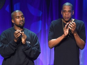 Kanye West (L) and Jay Z onstage at the Tidal launch event #TIDALforALL at Skylight at Moynihan Station on March 30, 2015 in New York City.  Jamie McCarthy/Getty Images for Roc Nation/AFP