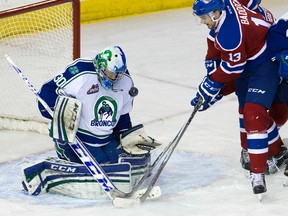 Vermilion native Brandon Baddock is stopped by the Swift Current Broncos’ goalie Landon Bow (30) during third period WHL action at Rexall Place, in Edmonton Alta. on Sunday Oct. 4, 2015.