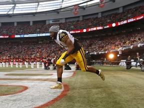 Hamilton Tiger Cats' Simoni Lawrence is introduced during ceremonies ahead of the start of the CFL's 102nd Grey Cup against the Calgary Stampeders in Vancouver on Nov. 30, 2014. (REUTERS/Todd Korol)