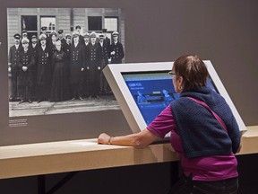A visitor views an exhibit at the Canadian Museum of Immigration at Pier 21 in Halifax on June 25, 2015. The facility has been renovated as part of a $30-million expansion that celebrates Canada's era of immigration with an emphasis on the period from 1928 to 1971. THE CANADIAN PRESS/Andrew Vaughan