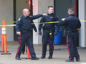 Winnipeg Police confer at the scene following the report of a suspicious package near the Delta Hotel in Winnipeg, Man. Monday November 02, 2015.
Brian Donogh/Winnipeg Sun/Postmedia Network