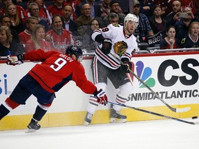 Blackhawks left wing Bryan Bickell (right) was demoted to the AHL on Monday after registering no points in seven games this season. (Alex Brandon/AP Photo)