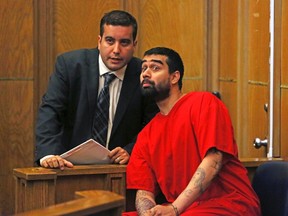 Derek Medina appears in court for his arraignment with attorney Mauricio Padilla in Miami, Florida August 29, 2013. Medina was arrested on a murder charge August 8, 2013 after confessing to shooting his wife and posting pictures of her body on Facebook. (REUTERS/Walter Michot/The Miami Herald/Pool)