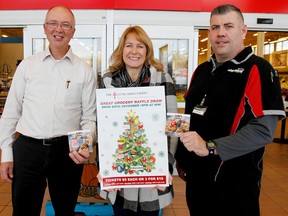 Emily Mountney-Lessard/The Intelligencer
Lola McMurter of the Lung Association, centre, promotes the Great Grocery and Gift Card Give Away at Smylie's Your Independent Grocer with John Smylie, left, and store manager Craig Potter, right, on Friday October 30, in Trenton.