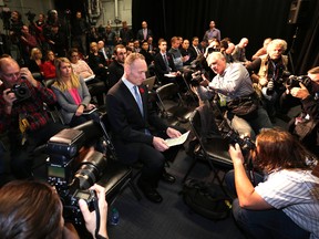 Toronto Blue Jays president Mark Shapiro is surrounded by media before his introductory press conference at the Rogers Centre in Toronto on Nov. 2, 2015. (Craig Robertson/Toronto Sun/Postmedia Network)