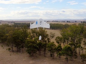 In this image released by Google, a drone lowers a package to the ground in Queensland, Australia. Google on August 28, 2014, said it is testing using drones to deliver items bought online, putting its own spin on similar efforts by Internet retail titan Amazon.com. (AFP PHOTO HANDOUT-GOOGLE)