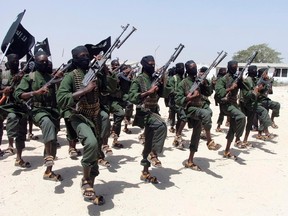 In this Thursday, Feb. 17, 2011 file photo, hundreds of newly trained al-Shabab fighters perform military exercises in the Lafofe area some 18 km south of Mogadishu, in Somalia. (AP Photo/Farah Abdi Warsameh, File)