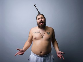 In this Oct. 29, 2015 photo, Josh "The Fat Jew" Ostrovsky poses for a portrait in New York. Ostrovsky and his upright ponytail have leaped off his racy Instagram account onto the pages of a new book, "Money Pizza Respect," a memoirish collection of debauchery out Tuesday, Nov. 3, 2015. (Photo by Drew Gurian/Invision/AP)