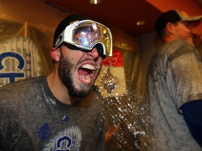 Eric Hosmer #35 of the Kansas City Royals celebrates in the clubhouse after defeating the New York Mets to win Game Five of the 2015 World Series at Citi Field on November 1, 2015 in the Flushing neighborhood of the Queens borough of New York City. The Kansas City Royals defeated the New York Mets with a score of 7 to 2 to win the World Series.   Elsa/Getty Images/AFP
