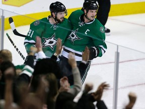 Dallas Stars' Tyler Seguin celebrates his goal with teammate Jamie Benn (14) during the third period of against the San Jose Sharks in Dallas on Oct. 31, 2015. (AP Photo/LM Otero)