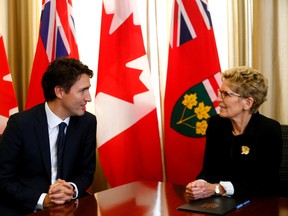 Prime Minister-designate Justin Trudeau is greeted at Queens Park by Ontario Premier Kathleen Wynne on Tuesday October 27, 2015. Michael Peake/Toronto Sun/Postmedia Network