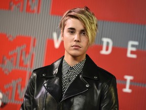 In this Aug. 30, 2015, file photo, Justin Bieber arrives at the MTV Video Music Awards in Los Angeles. Bieber received a favourable probation report in a misdemeanor vandalism case on Monday, Nov. 2, 2015, and a Los Angeles judge ruled that the pop singer will no longer be on supervised probation in the case, which was filed after he damaged a former neighbor's house with eggs. (Jordan Strauss/Invision/AP, File)