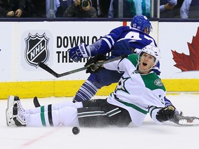Leo Komarov of the Toronto Maple Leafs is taken down by John Klingberg of the Dallas Stars during NHL action at the Air Canada Centre in Toronto on Monday November 2, 2015. (DAVE ABEL/Toronto Sun)