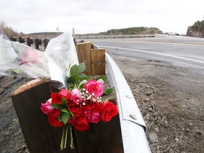 A memorial rests on the guard rail on the Highway 17 bypass at Southview Drive, where high school student Kodee Daoust was killed in October 2015. (Gino Donato/Sudbury Star)