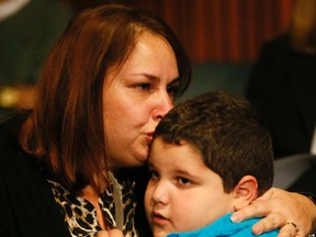 Linda Di Mambro and her seven-year-old autistic son Anthony at a press conference held byNDP Leader Andrea Horwath and Autism Ontario on Tuesday, Nov 3, 2015.  (STAN BEHAL/Toronto Sun)