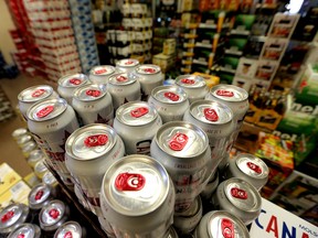 Beer flats sit in the cooler at the Royal Liquor Merchants on Elbow Drive in SW Calgary, Alta. on Tuesday October 27, 2015. The province plans on hitting Albertan's with the sin tax for the second time this year. Stuart Dryden/Calgary Sun/Postmedia Network