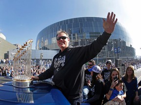 Royals manager Ned Yost waves to the crowd during a parade celebrating the Royals winning the World Series in Kansas City, Mo., on Tuesday, Nov. 3, 2015. The Royals beat the New York Mets in five games to win the championship. (Charlie Riedel/AP Photo)