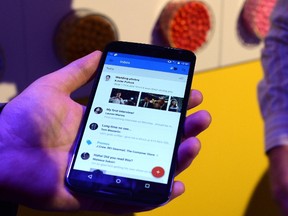 This October 29, 2014 file photo shows Google's lead designer for "Inbox by Gmail" Jason Cornwell as he shows the app's functionalities on a nexus 6 android phone during a media preview in New York. (AFP PHOTO/JEWEL SAMAD)