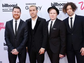 Andy Hurley, from left, Pete Wentz, Patrick Stump, and Joe Trohman of the musical group Fall Out Boy arrive at the Billboard Music Awards at the MGM Grand Garden Arena on Sunday, May 17, 2015, in Las Vegas. Grammy-nominated rock band Fall Out Boy will perform at halftime during the Grey Cup game, the CFL announced Tuesday. THE CANADIAN PRESS/AP-Photo by Eric Jamison/Invision/AP