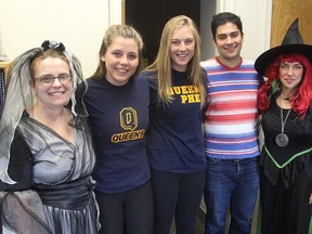 QECVI phys ed department head Joanna Belfer, left, and principal Anne Marie McDonald, right, dressed for Halloween, join QJump participants Kathleen Hogan, second from left, Emma Lambert and Jacob Bonafiglia in Kingston recently. (Michael Lea/The Whig-Standard)