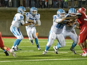 Head coach Rob Strecker considers this game – an early-season exhibition between the Paul Kane Blues and Groesbeck High School – a vital part of Paul Kane’s season. The Blues outscored their Texas hosts in the last half of the game but bowed 44-16 and Strecker said valuable lessons were learned. Here, quarterback Brendan Guy hands to Ty Beck as blockers Jake Parent and Zach Dreger lead the charge. Paul Kane faces the Harry Ainlay Titans Friday in one of two Carr Conference semi-finals as Alberta’s high school football season grinds to a close. (Supplied)