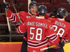 Oshawa Generals defenceman Stephen Desrocher celebrates his goal with teammates Mitch Vande Sompel and Jacob Busch during an Ontario Hockey League game in Ottawa on Oct. 13, 2014. The Kingston Frontenacs acquired Desrocher on Tuesday. (Postmedia Network file photo)