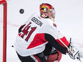 Ottawa Senators goalie Craig Anderson looses sight of the puck as they face the Montreal Canadiens during first period NHL hockey action Tuesday, November 3, 2015 in Montreal. THE CANADIAN PRESS/Paul Chiasson